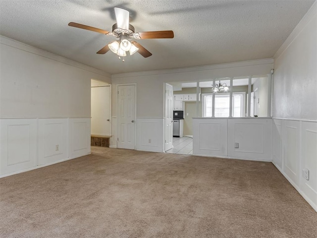 4113 Clendon Way, Del City, OK 73115 - spare room with a ceiling fan, light colored carpet, crown molding, a chandelier, and wainscoting