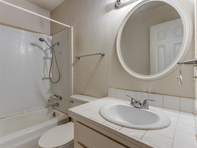 4113 Clendon Way, Del City, OK 73115 - bathroom featuring bathtub / shower combination, vanity, and a textured wall