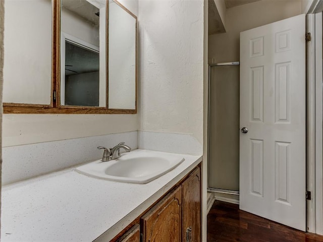 4113 Clendon Way, Del City, OK 73115 - bathroom with vanity, a shower stall, and wood finished floors