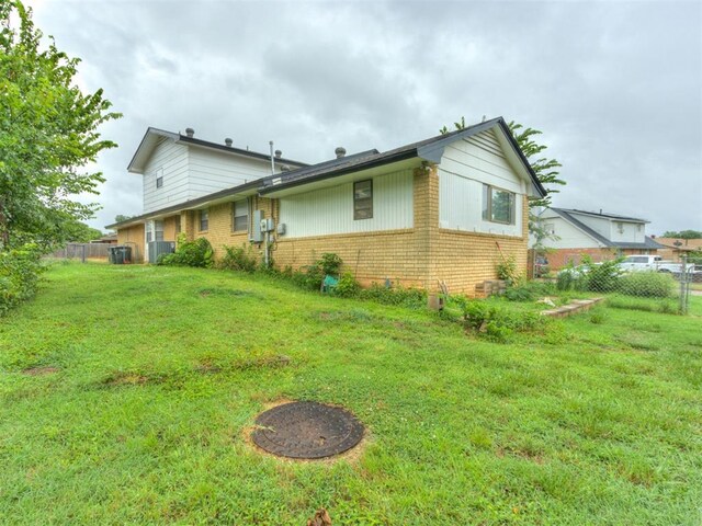 4113 Clendon Way, Del City, OK 73115 - rear view of house featuring brick siding