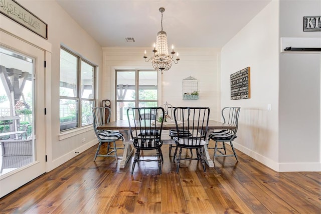 209 Pont Julienn Ct, Edmond, OK 73034 - dining space featuring a chandelier and hardwood / wood-style floors