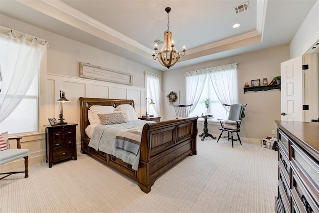 209 Pont Julienn Ct, Edmond, OK 73034 - bedroom featuring a chandelier, light colored carpet, a tray ceiling, and crown molding