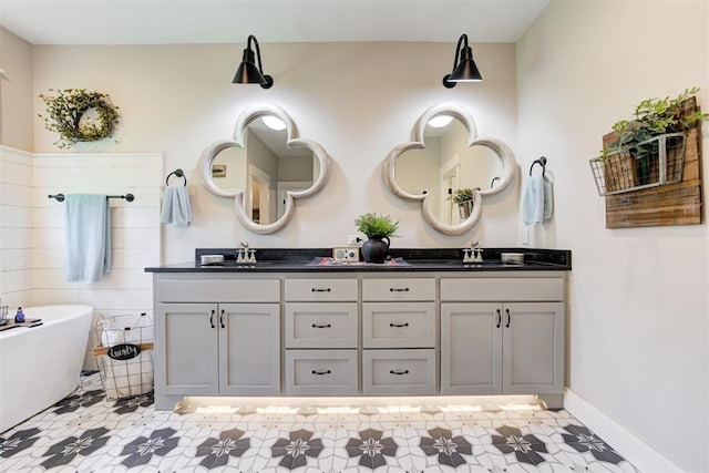 209 Pont Julienn Ct, Edmond, OK 73034 - full bath with double vanity, a freestanding tub, and tile patterned floors
