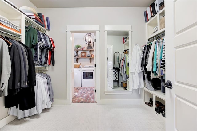 209 Pont Julienn Ct, Edmond, OK 73034 - walk in closet featuring washer and dryer, carpet floors, and a chandelier