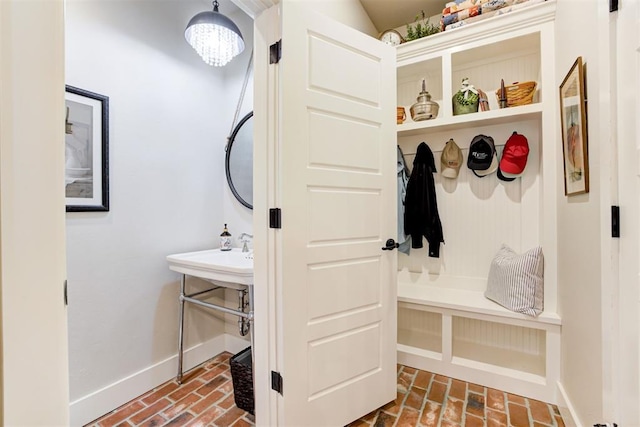 209 Pont Julienn Ct, Edmond, OK 73034 - mudroom with brick flooring and baseboards