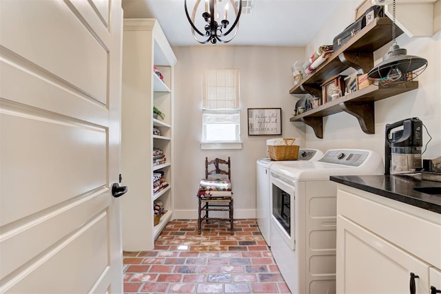 209 Pont Julienn Ct, Edmond, OK 73034 - laundry area featuring brick floors, washing machine and dryer, and a chandelier