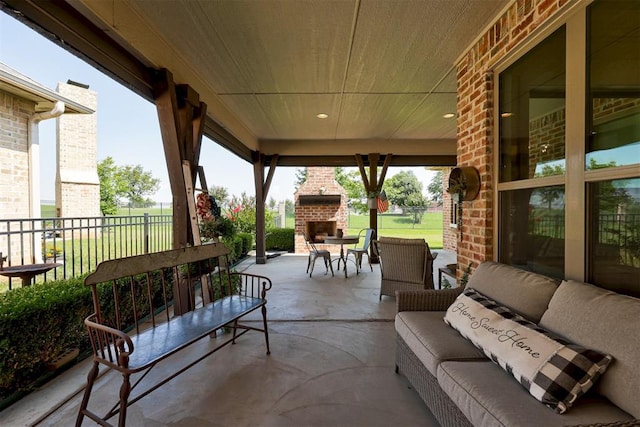 209 Pont Julienn Ct, Edmond, OK 73034 - view of patio with an outdoor living space with a fireplace