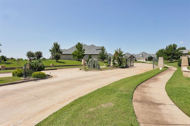 209 Pont Julienn Ct, Edmond, OK 73034 - view of concrete street with curbs and a residential view