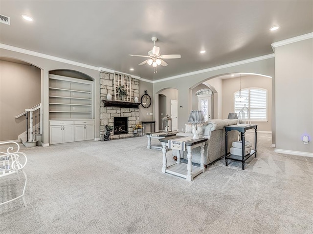 210 Bulverde Dr, Norman, OK 73069 - carpeted living area featuring ceiling fan, crown molding, a fireplace, built in features, and recessed lighting