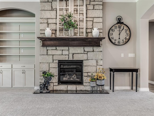 210 Bulverde Dr, Norman, OK 73069 - detailed view of arched walkways, carpet flooring, and a stone fireplace