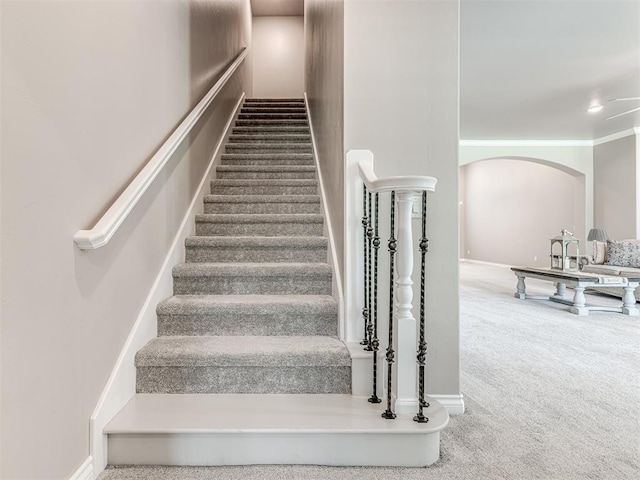 210 Bulverde Dr, Norman, OK 73069 - stairs with carpet floors and arched walkways