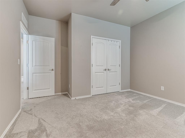 210 Bulverde Dr, Norman, OK 73069 - unfurnished bedroom with carpet, a closet, and ceiling fan