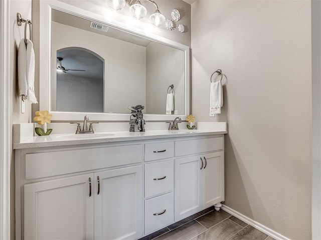 210 Bulverde Dr, Norman, OK 73069 - bathroom with double vanity and a ceiling fan