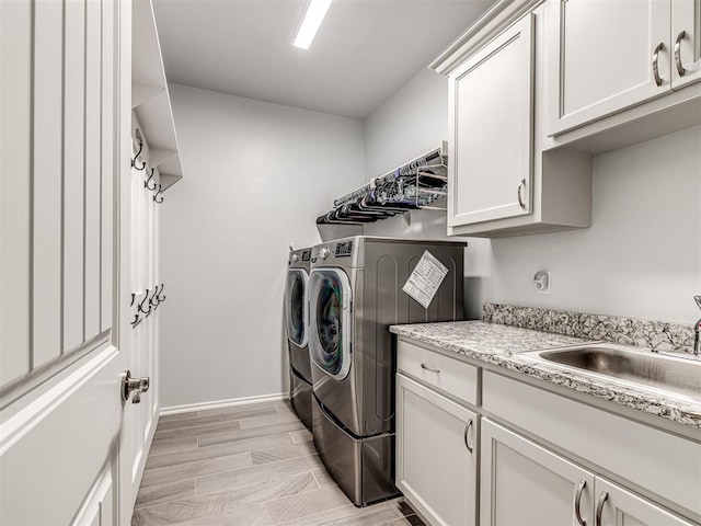 210 Bulverde Dr, Norman, OK 73069 - laundry room featuring washer and dryer and cabinet space