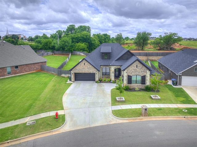 210 Bulverde Dr, Norman, OK 73069 - french provincial home with stone siding, concrete driveway, an attached garage, and roof with shingles