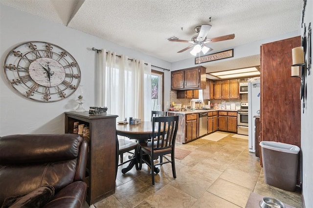 809 N Southminster St, Moore, OK 73160 - dining space featuring ceiling fan and a textured ceiling