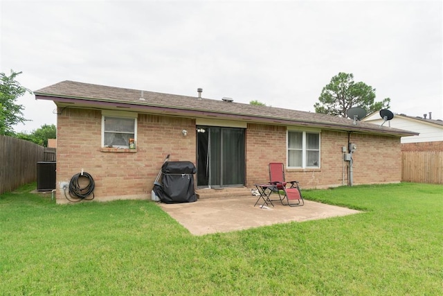809 N Southminster St, Moore, OK 73160 - back of house featuring a fenced backyard, a patio area, and brick siding