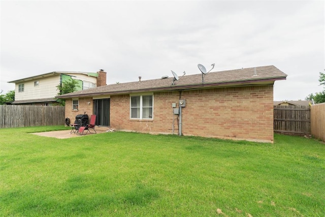809 N Southminster St, Moore, OK 73160 - rear view of property with a fenced backyard, brick siding, a patio area, and a chimney