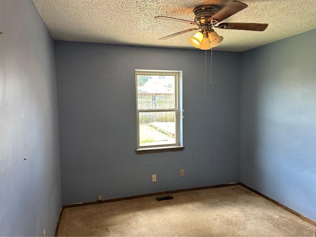 1408 NW 107th St, Oklahoma City, OK 73114 - unfurnished room with carpet flooring, ceiling fan, and a textured ceiling