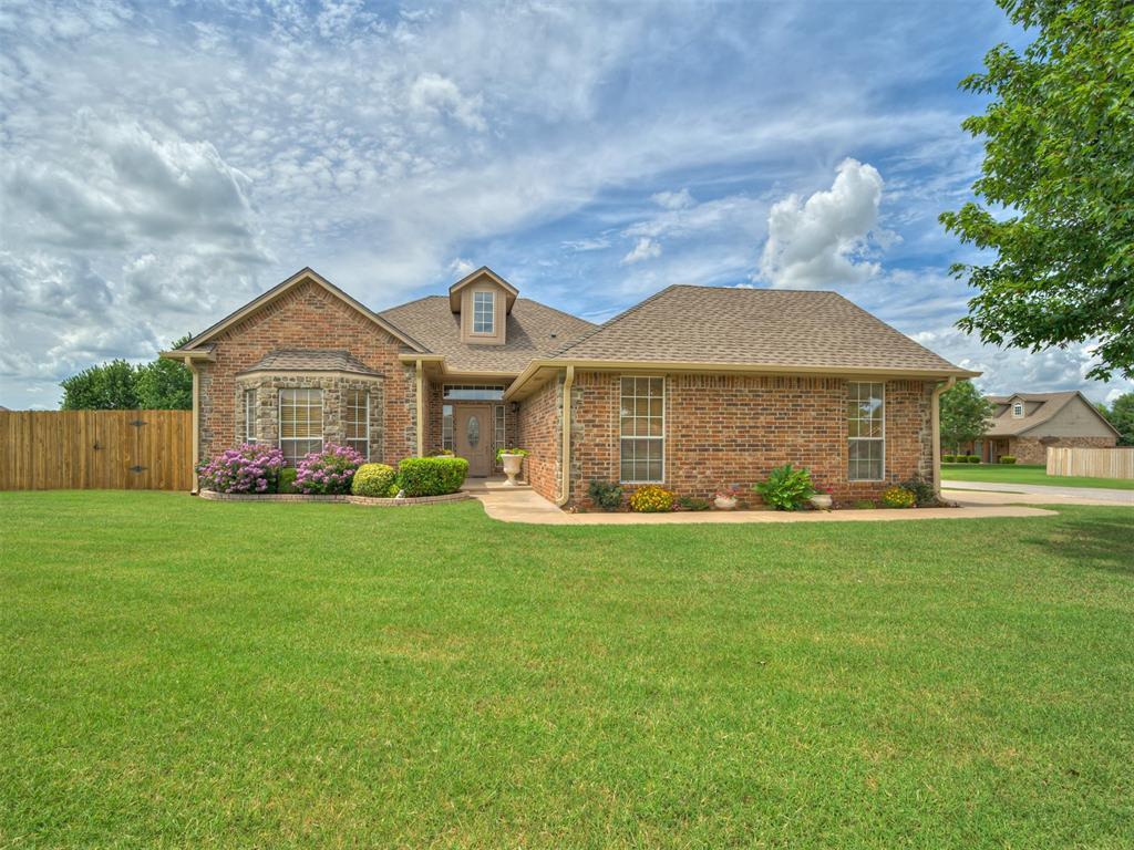 3587 Remington Place Rd, Norman, OK 73072 - traditional home with brick siding and a shingled roof