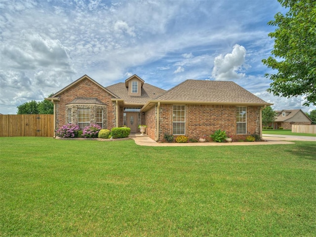 3587 Remington Place Rd, Norman, OK 73072 - traditional home with brick siding and a shingled roof