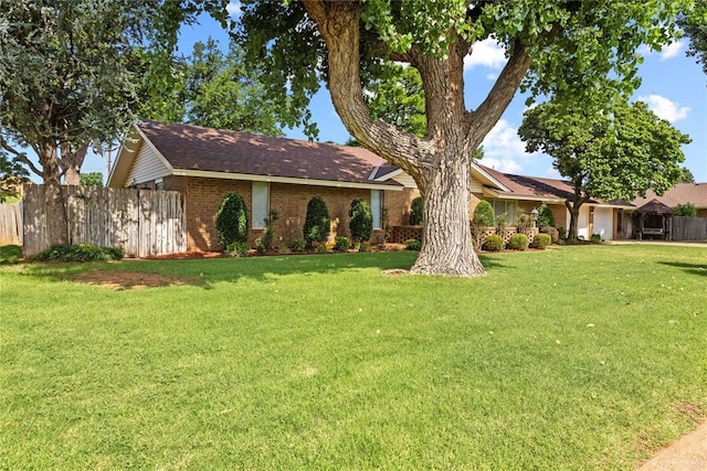 717 Maple St, Weatherford, OK 73096 - single story home with brick siding