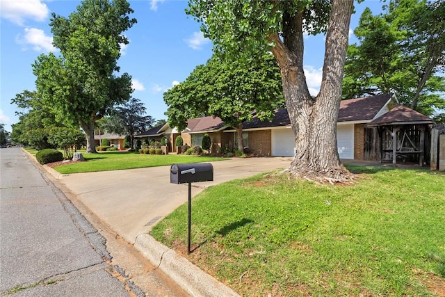 717 Maple St, Weatherford, OK 73096 - ranch-style home featuring driveway, a front yard, a garage, and brick siding