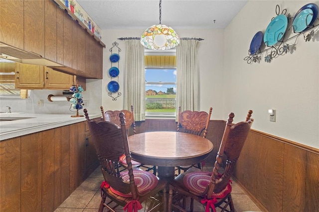 717 Maple St, Weatherford, OK 73096 - dining space with a wainscoted wall