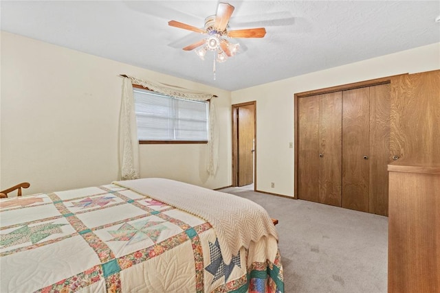 717 Maple St, Weatherford, OK 73096 - bedroom with light carpet, a closet, and ceiling fan