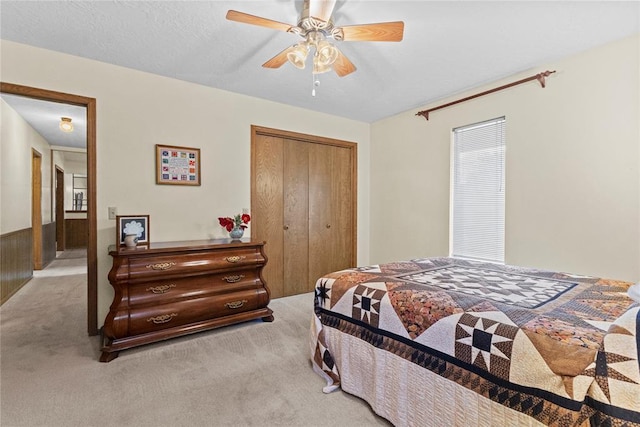 717 Maple St, Weatherford, OK 73096 - bedroom with carpet, a closet, and a ceiling fan