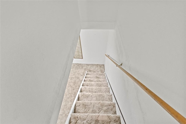 717 Maple St, Weatherford, OK 73096 - stairway featuring carpet