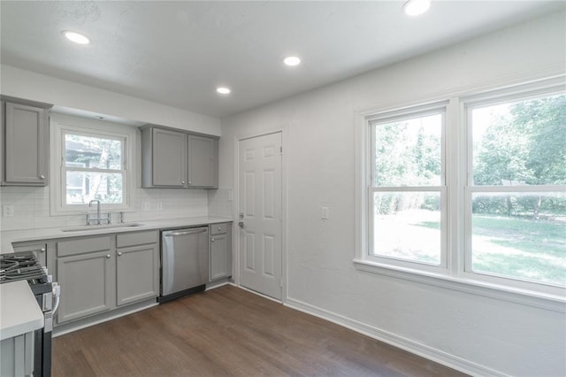 933 SW 50th St, Oklahoma City, OK 73109 - kitchen with stainless steel appliances, gray cabinetry, dark wood-type flooring, recessed lighting, and light countertops