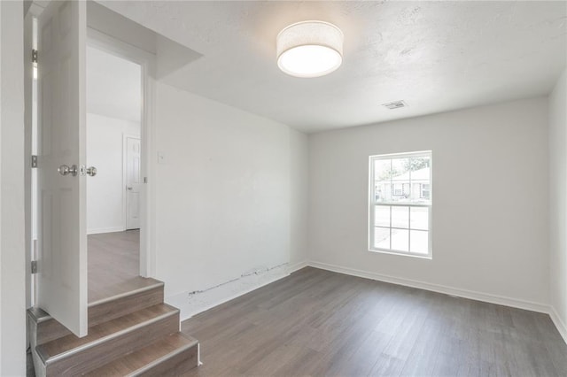 933 SW 50th St, Oklahoma City, OK 73109 - spare room with wood finished floors and baseboards