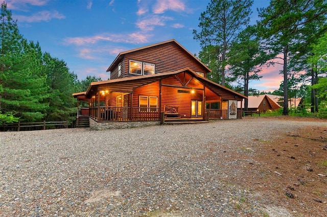 232 Orange Grove Rd, Broken Bow, OK 74728 - view of front of home with faux log siding and gravel driveway