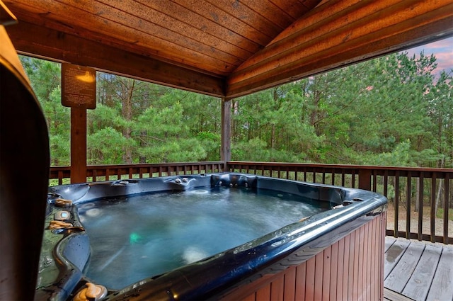 232 Orange Grove Rd, Broken Bow, OK 74728 - deck with a hot tub and a wooded view