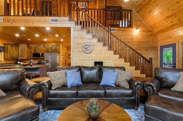 232 Orange Grove Rd, Broken Bow, OK 74728 - living area with wooden walls, stairs, and recessed lighting