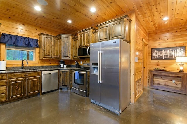 232 Orange Grove Rd, Broken Bow, OK 74728 - kitchen with stainless steel appliances, concrete flooring, wooden walls, recessed lighting, and wood ceiling