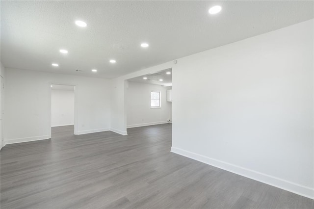 3916 S Youngs Pl, Oklahoma City, OK 73119 - empty room with recessed lighting, wood finished floors, and a textured ceiling
