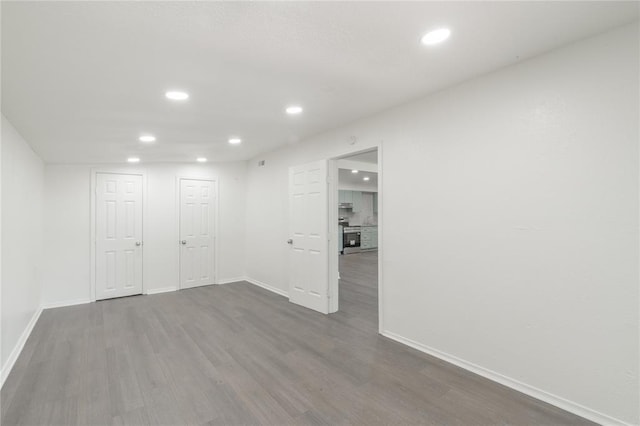 3916 S Youngs Pl, Oklahoma City, OK 73119 - unfurnished room featuring recessed lighting and dark wood-type flooring