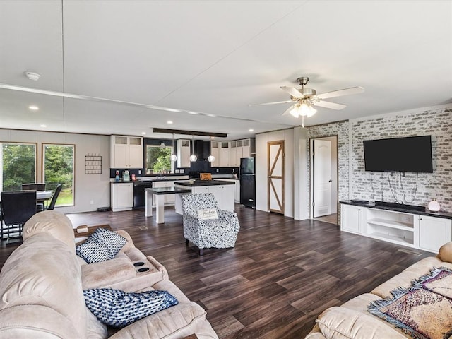 living area featuring recessed lighting, ceiling fan, and dark wood finished floors