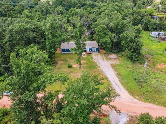 view from above of property with a forest