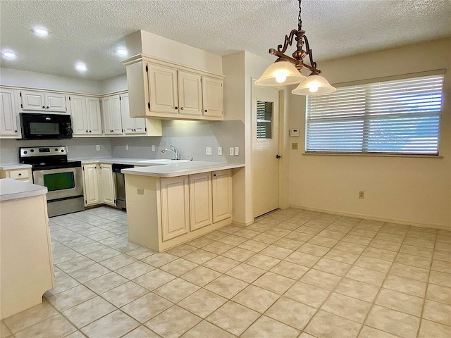 223 E Lincoln Ave, Edmond, OK 73034 - kitchen featuring stainless steel range with electric cooktop, black microwave, light countertops, a peninsula, and a textured ceiling