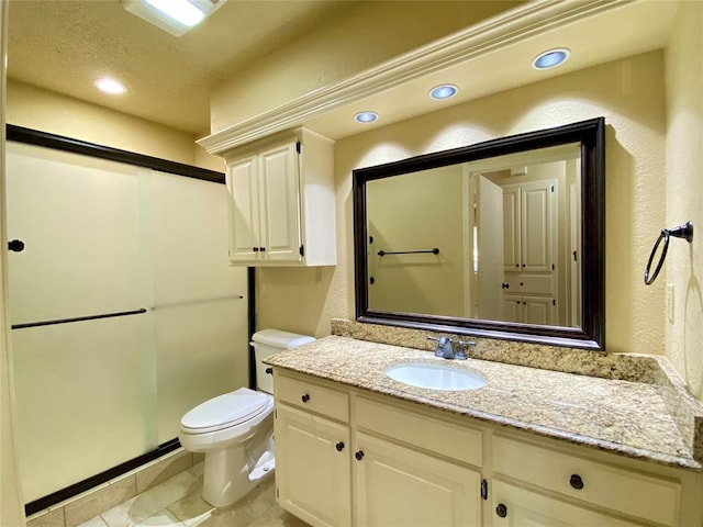 223 E Lincoln Ave, Edmond, OK 73034 - bathroom with vanity, a shower stall, recessed lighting, tile patterned floors, and a textured wall