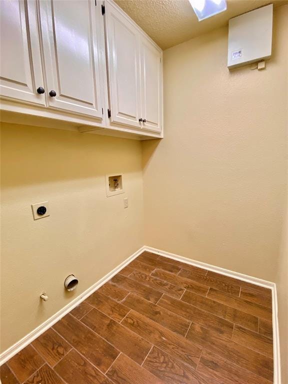 223 E Lincoln Ave, Edmond, OK 73034 - washroom with hookup for an electric dryer, dark wood finished floors, washer hookup, cabinet space, and gas dryer hookup