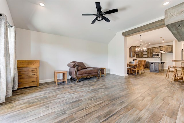 2408 NW 179th St, Edmond, OK 73012 - sitting room featuring vaulted ceiling, light wood-type flooring, a ceiling fan, a chandelier, and recessed lighting