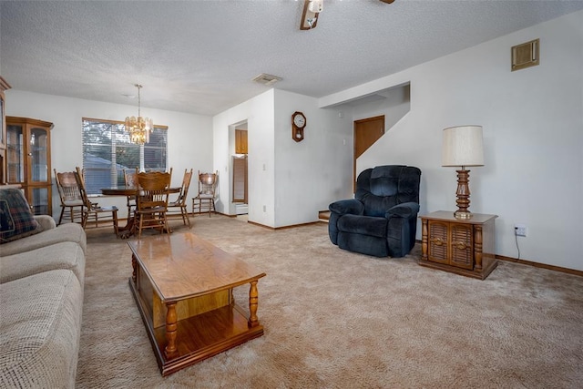 29877 Fishmarket Rd, Macomb, OK 74852 - living room featuring a textured ceiling, a chandelier, and carpet floors