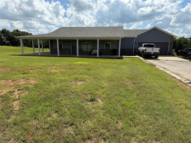 105967 S Rolling Hills Dr, Meeker, OK 74855 - view of front facade with covered porch, driveway, a front yard, and an attached garage