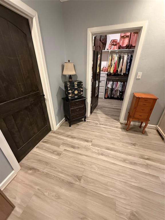 105967 S Rolling Hills Dr, Meeker, OK 74855 - corridor with light wood finished floors