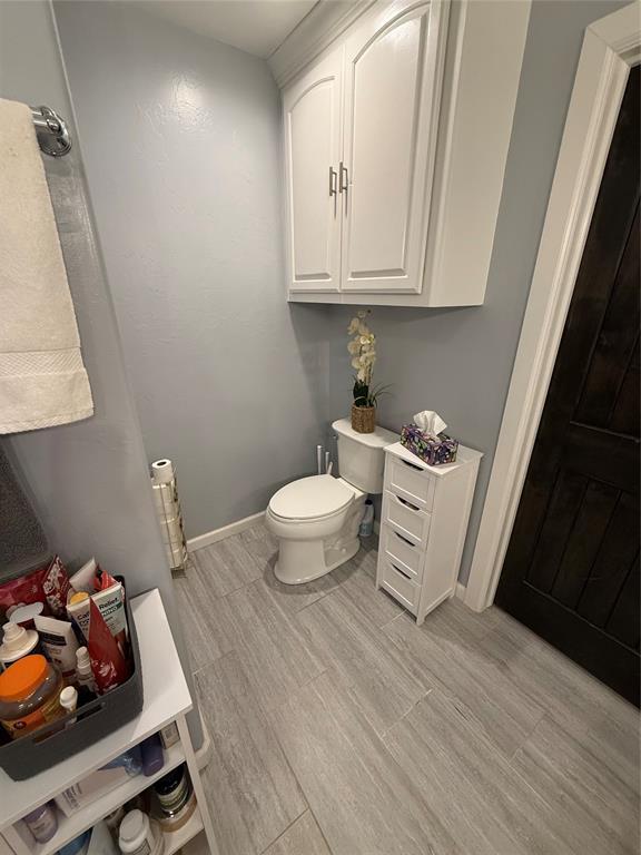 105967 S Rolling Hills Dr, Meeker, OK 74855 - bathroom with toilet and wood finished floors