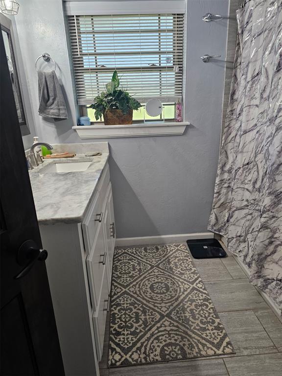 105967 S Rolling Hills Dr, Meeker, OK 74855 - full bathroom featuring vanity and curtained shower